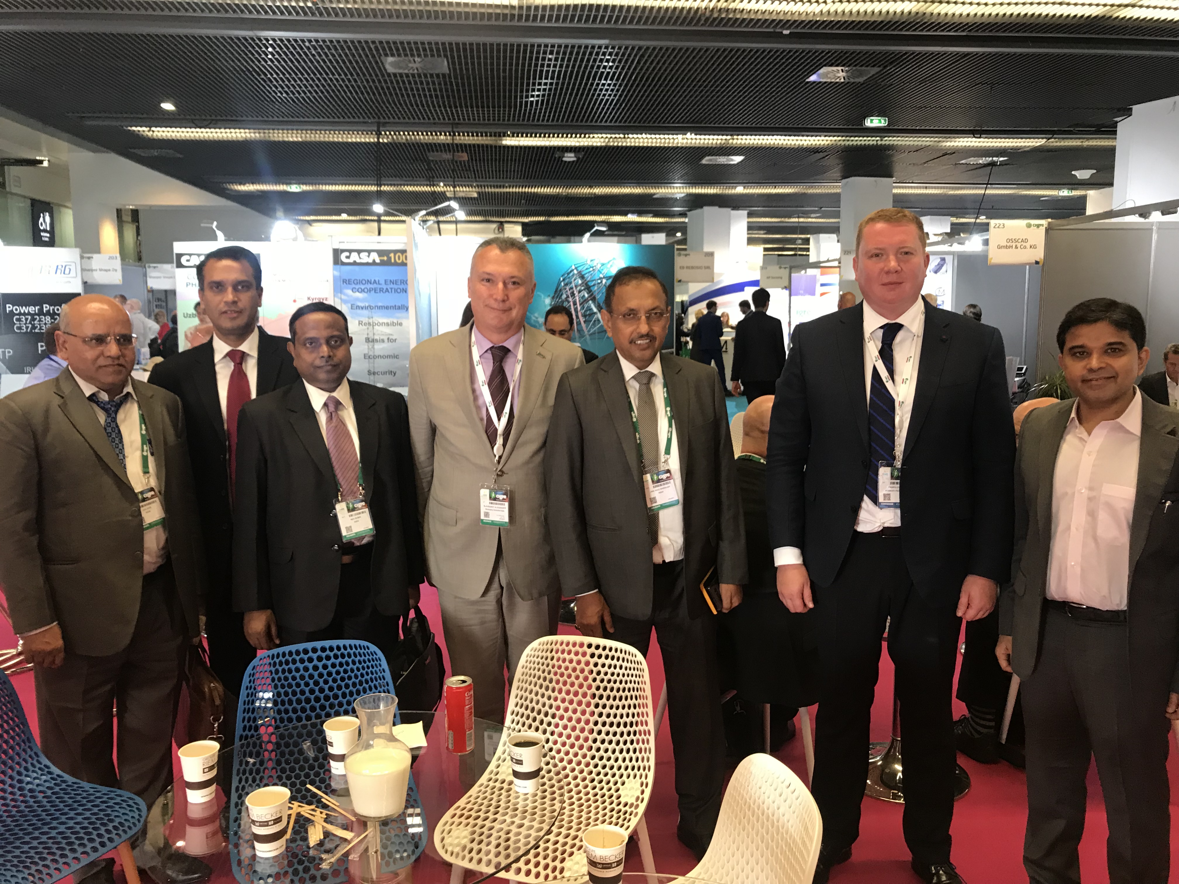 Trilateral meeting at the 47th CIGRE Session. Center – Chairman of the Board of Directors at Izolyator Alexander Slavinsky, L-R: Chairman and General Manager of PowerGrid I. S. Jha (I.S. Jha), Commercial Director and 1st Dpty CEO at Izolyator Ivan Panfilov and Executive Director at Mehru Electrical & Mechanical Engineers (P) Ltd. Sandeep Prakash Sharma
