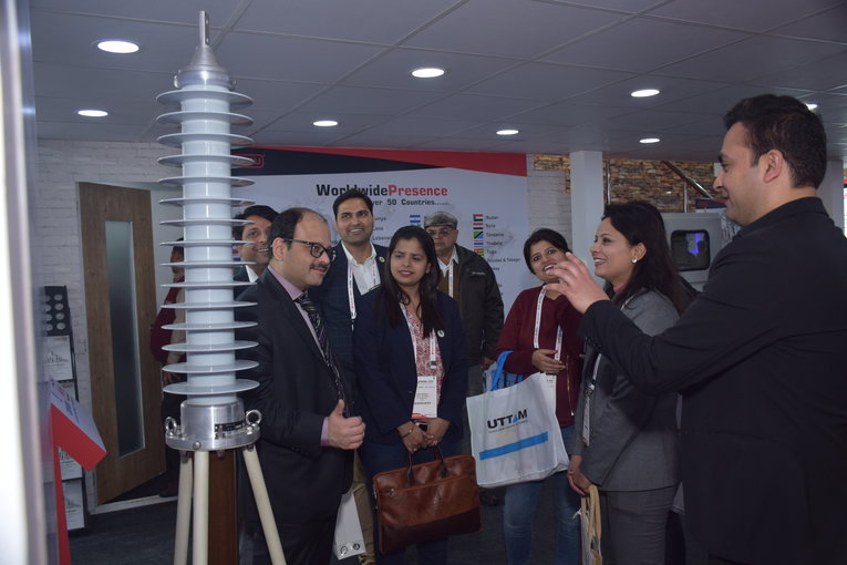Marketing, Sales and Sourcing Director of Massa Izolyator Mehru Pvt. Ltd. Mandeep Prakash Sharma (near the bushing replica) is giving answers to the questions of visitors concerning the advantages of HV RIP bushings